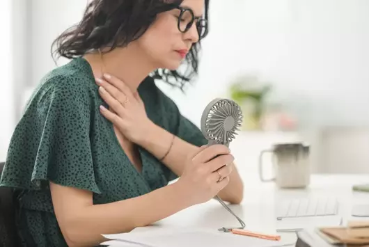 Hot Flashes At Work? New Study Reveals You May Be Handling Them The Wrong Way