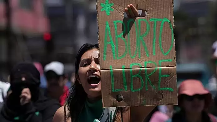 Protesters march for unrestricted abortion access in Chile and Colombia