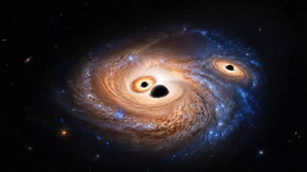Three giant black holes discovered in a galaxy from the dawn of time