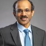 India-born US citizen drives research into light at sanctioned Chinese school