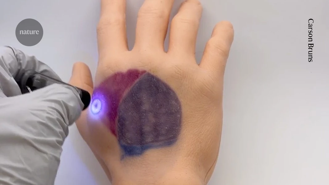 Watch this invisible tattoo appear under UV light