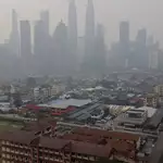 Malaysia urged to police its firms in Indonesia as haze shuts schools