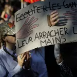 France suspends the use of stun grenades after student protester loses hand