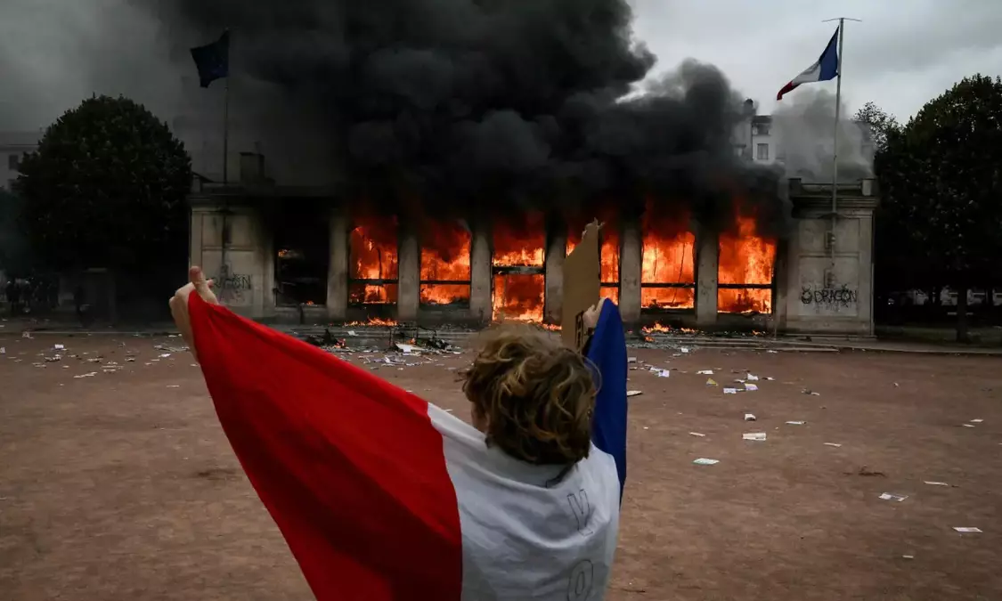 Smashed storefronts, torched cars and graffiti — France protests and their aftermath in pictures