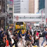 Hong Kong pay growth slows as Guangdong accelerates, survey finds