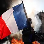 Hong Kong issues amber travel alert for France as school protests turn violent