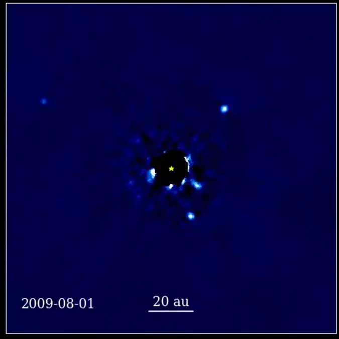 A 12-year sequence of telescope images of a star and four planets orbiting