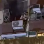 Boy, 13, rescued after climbing onto air-conditioning unit to escape fire in flat