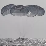 NASA astronauts splash down after 100 million miles in space
