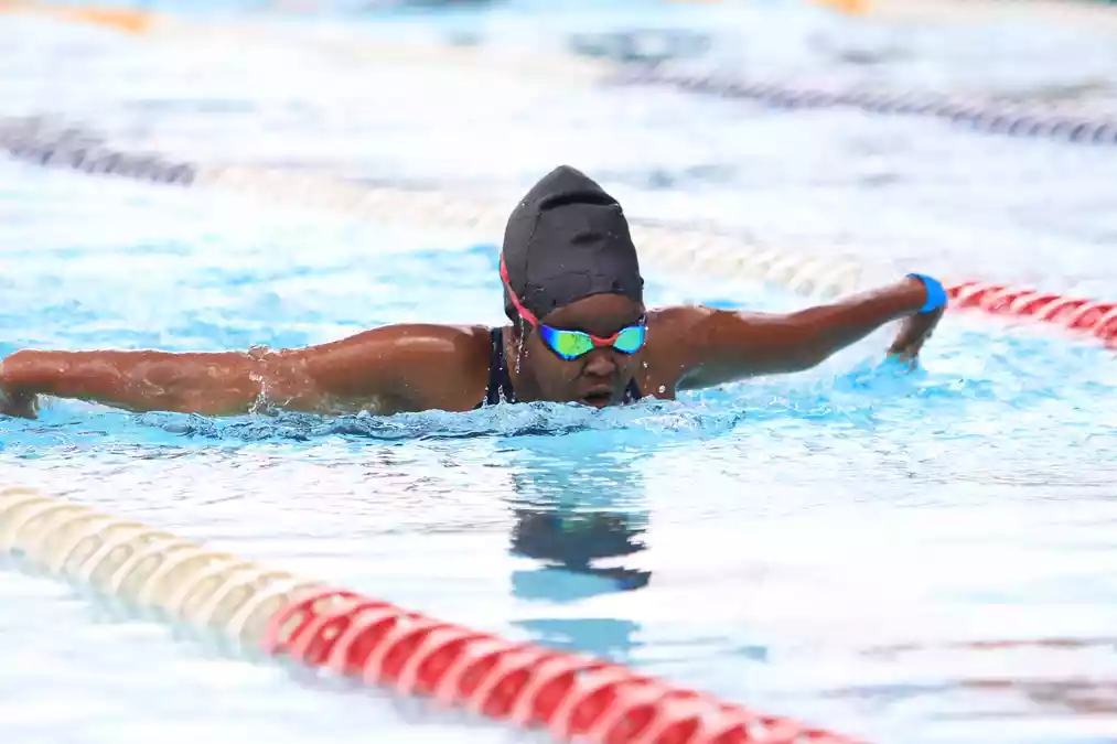 Flawless captain Mghoi strikes four gold, defends 50m backstroke