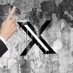 X is nudging users to promote their posts with a pointing hand, and people are confused