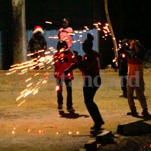 Children in Embakasi Village, Nairobi, celebrate Christmas and Boxing Day on December 26, 2025, commemorating the birth of Jesus Christ. Amid the high cost of living, they creatively improvise fireworks using steel wool, spreading joy and festive spirit.